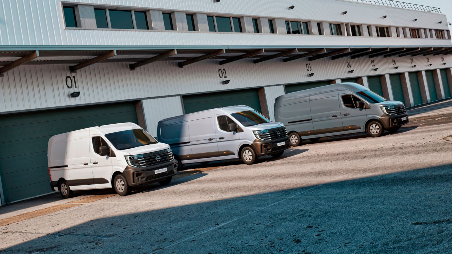 Nissan Interstar Van bodies and conversions parked in front of solar panels